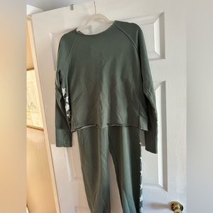 Green sweatsuit with white stars